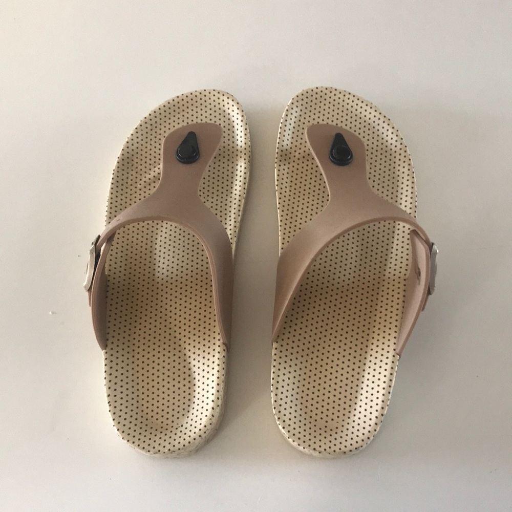 Slip on thong type sandals.